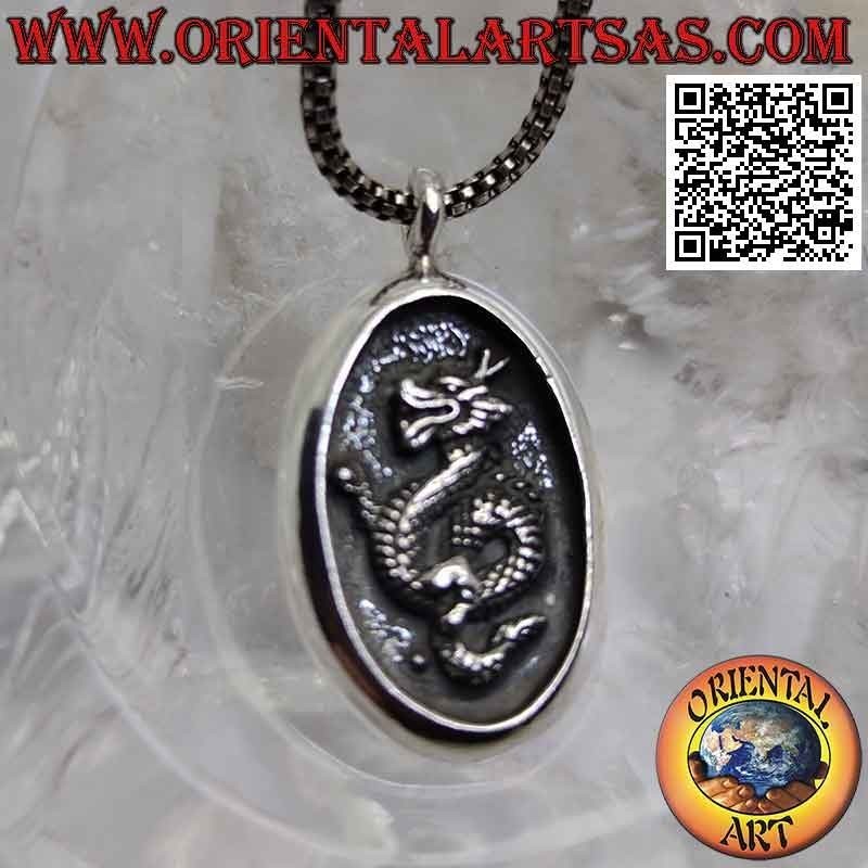 Silver pendant, oval medal with Nepalese dragon in bas-relief