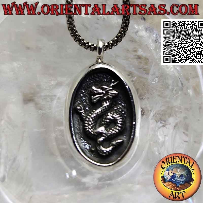 Silver pendant, oval medal with Nepalese dragon in bas-relief