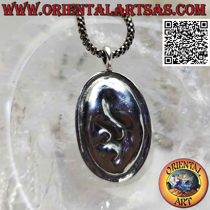 Silver pendant, oval medal with Nepalese dragon in bas-relief