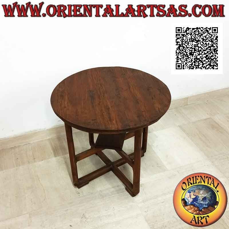 Round table with four legs intersected in the center on two levels in antique teak wood (65 cm Ø)