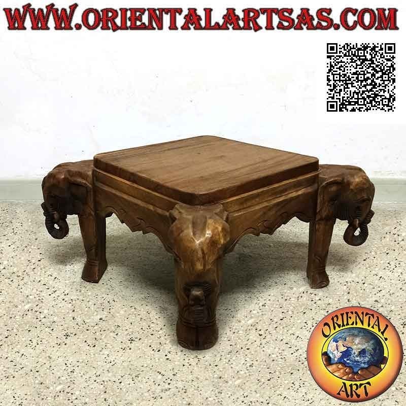 Mesita baja con cabeza de elefante en las cuatro esquinas en madera de teca