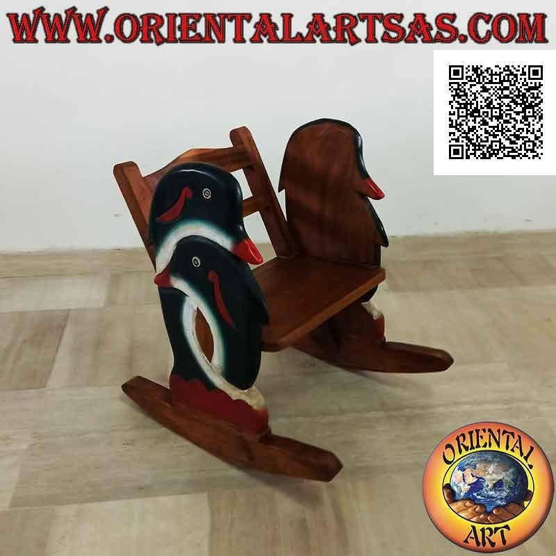 Banco mecedora para niños en madera de Suar (maciza) con delfines pintados en los laterales