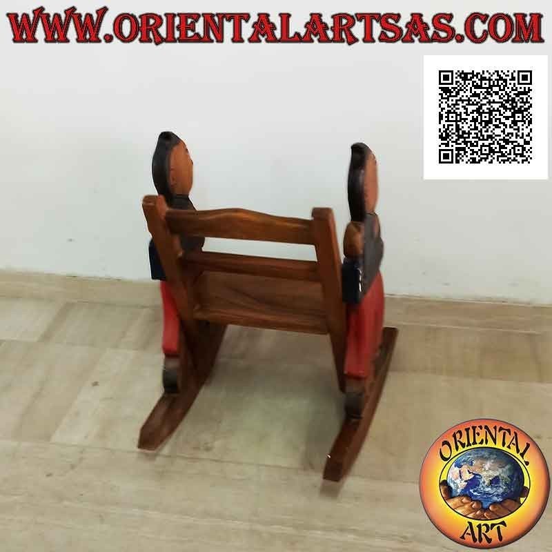 Banco mecedora para niños en madera de Suar (maciza) con estudiante (azul) pintado en los laterales