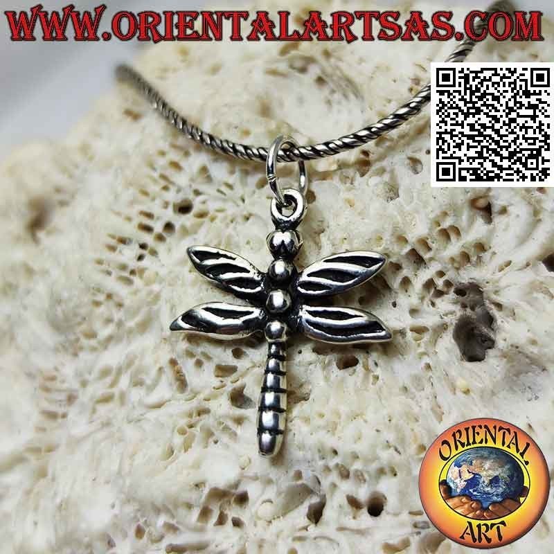 Silver pendant in the shape of a dragonfly shaped and engraved in the details