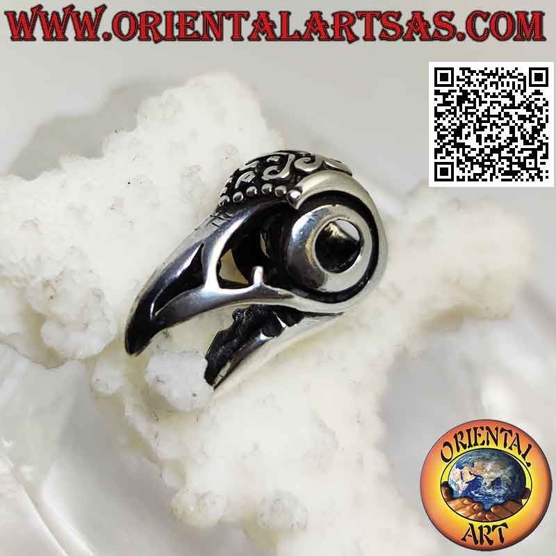 Silver pendant, the raptor's beak (decorated and pierced)