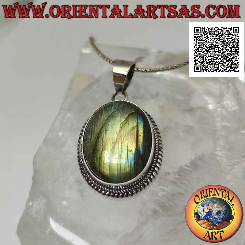 Silver pendant with a large oval cabochon labradorite surrounded by weaving