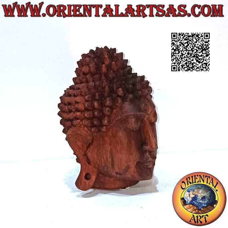 Three-dimensional Buddha head sculpture carved from a single 16 cm block of suar wood