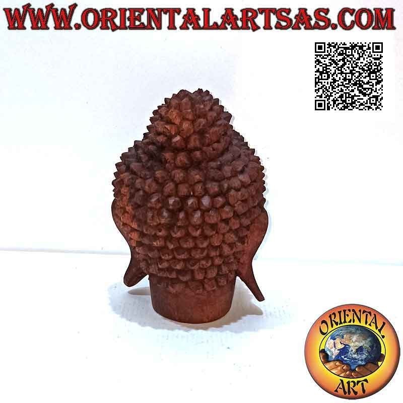 Three-dimensional Buddha head sculpture carved from a single 16 cm block of suar wood