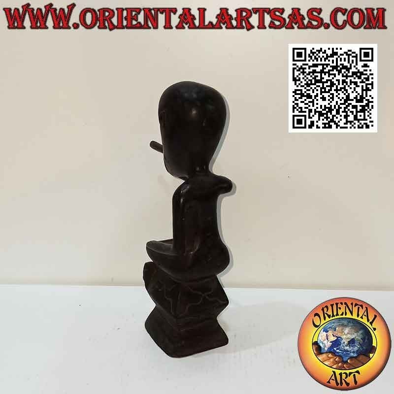 Sculpture of a seated indigenous smoker in ebony wood