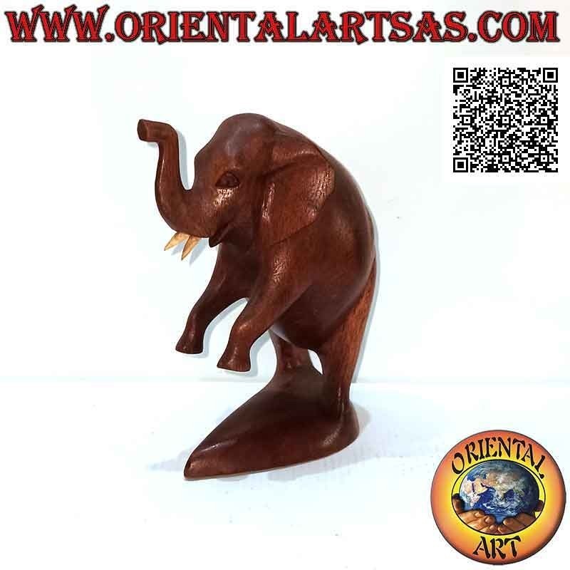 Sculpture of an African elephant on two legs with trunk up, in suar wood (17 cm)