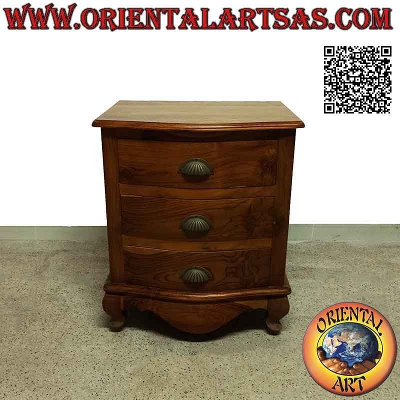 Rounded bedside table with three drawers with curved feet and brass handles in teak wood