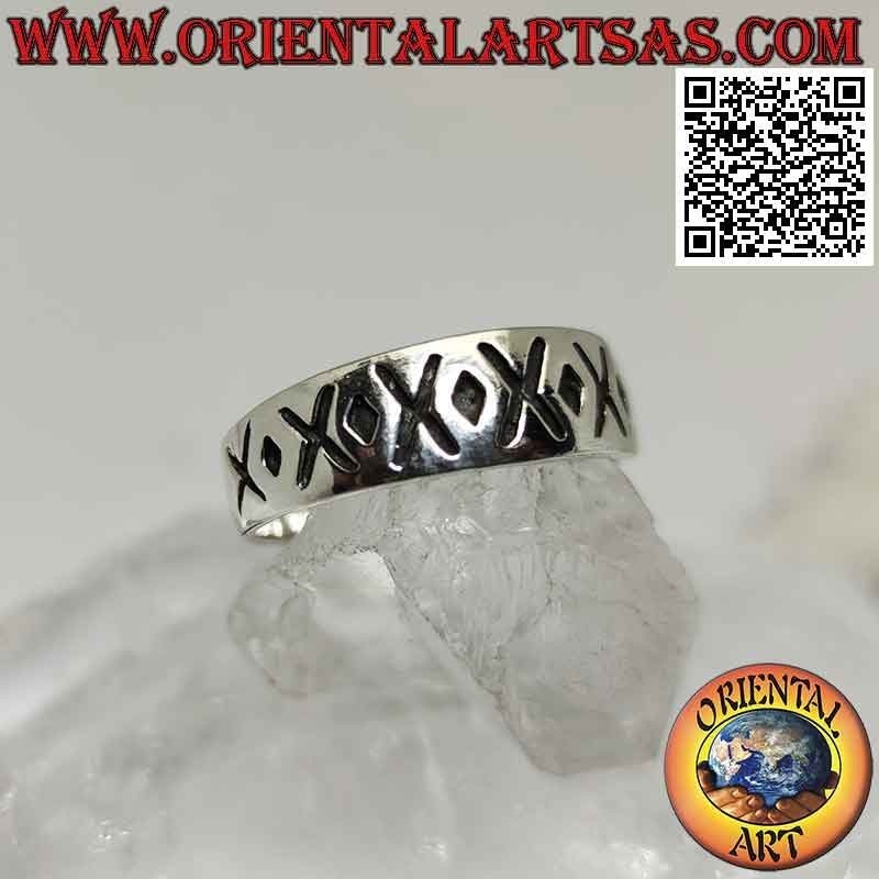 Silver ring with crescent band with alternating engraved X and dot