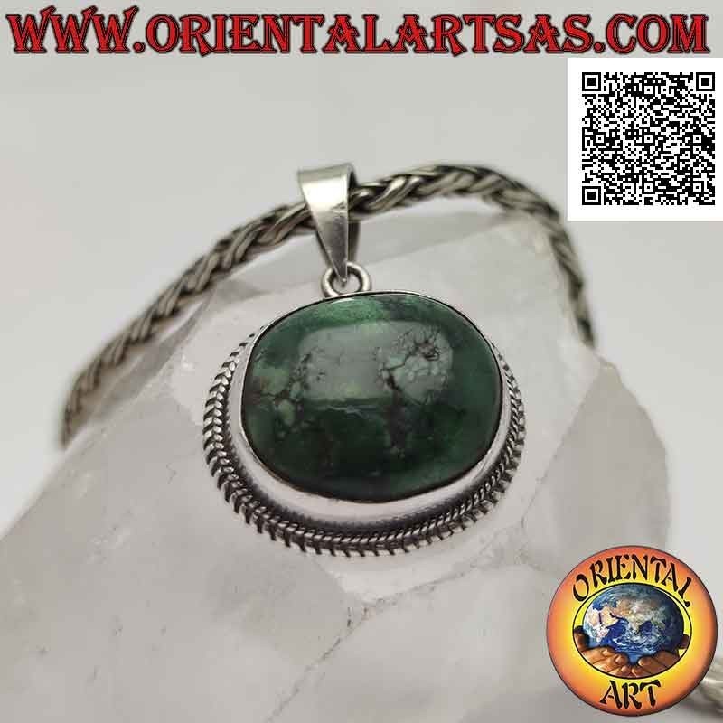 Ciondolo in argento con turchese antico tibetano naturale ovale irregolare contornato da doppio intreccio