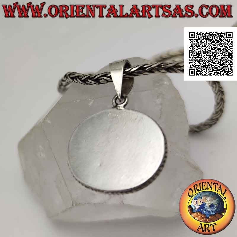 Ciondolo in argento con turchese antico tibetano naturale ovale irregolare contornato da doppio intreccio
