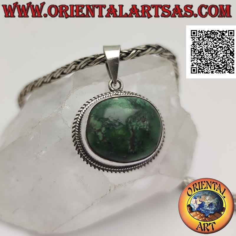 Colgante de plata con turquesa antigua tibetana irregular ovalada natural rodeada por un tejido doble