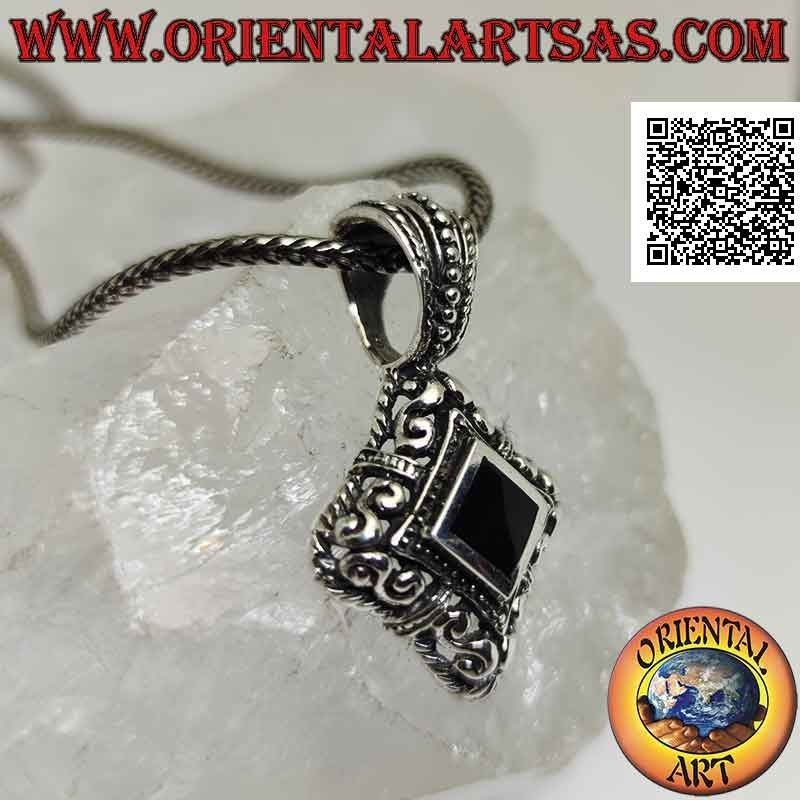 Silver pendant with rhomboidal onyx surrounded by Greek frets on perforated and rounded frame with hollow sides