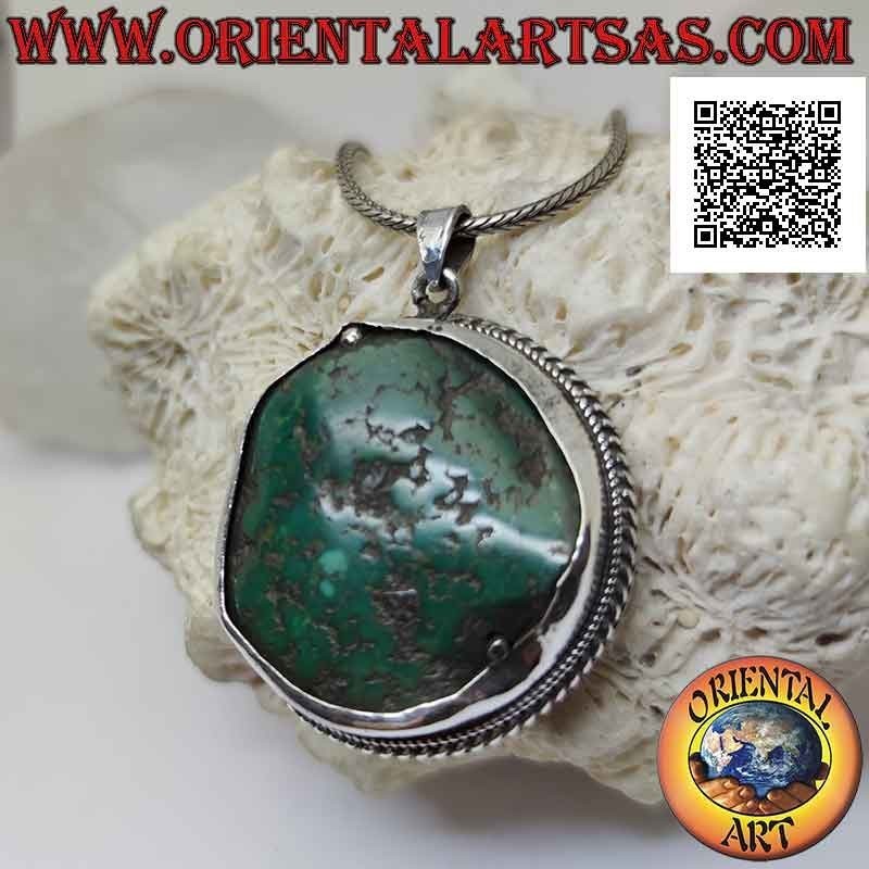 Ciondolo in argento antico con turchese tibetano naturale irregolare contornato da intreccio