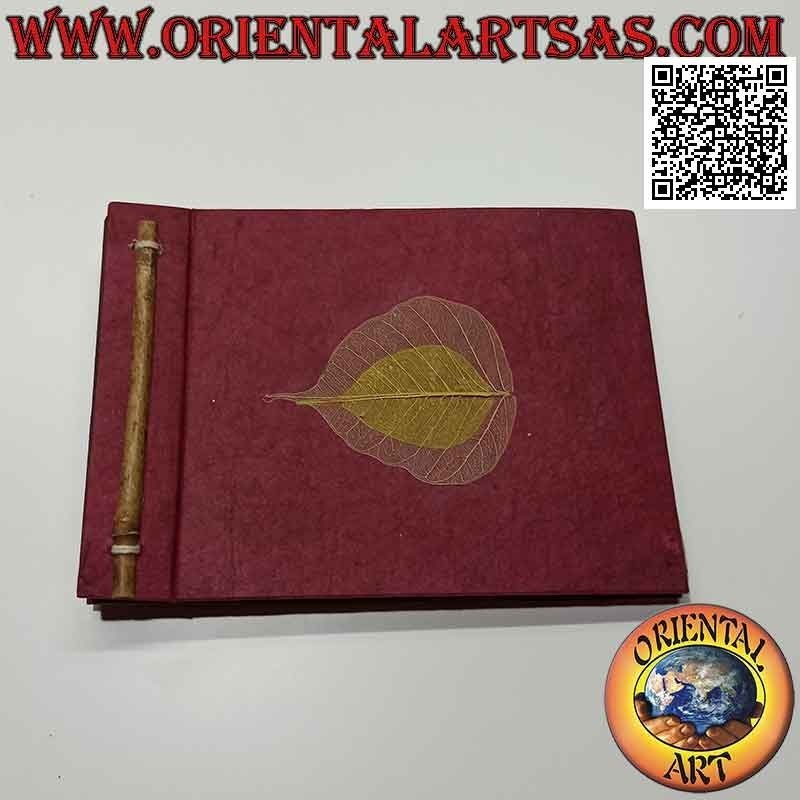 Photo album in Nepalese rice paper and black leaf sheets, (14 x 19 cm)