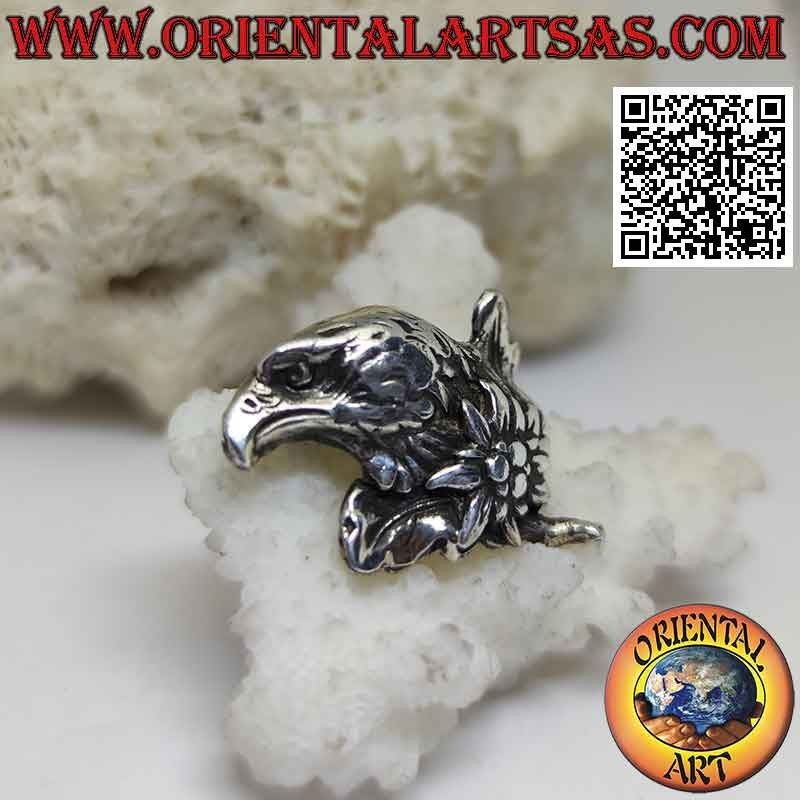 Silver brooch, eagle face in profile with flower on the neck