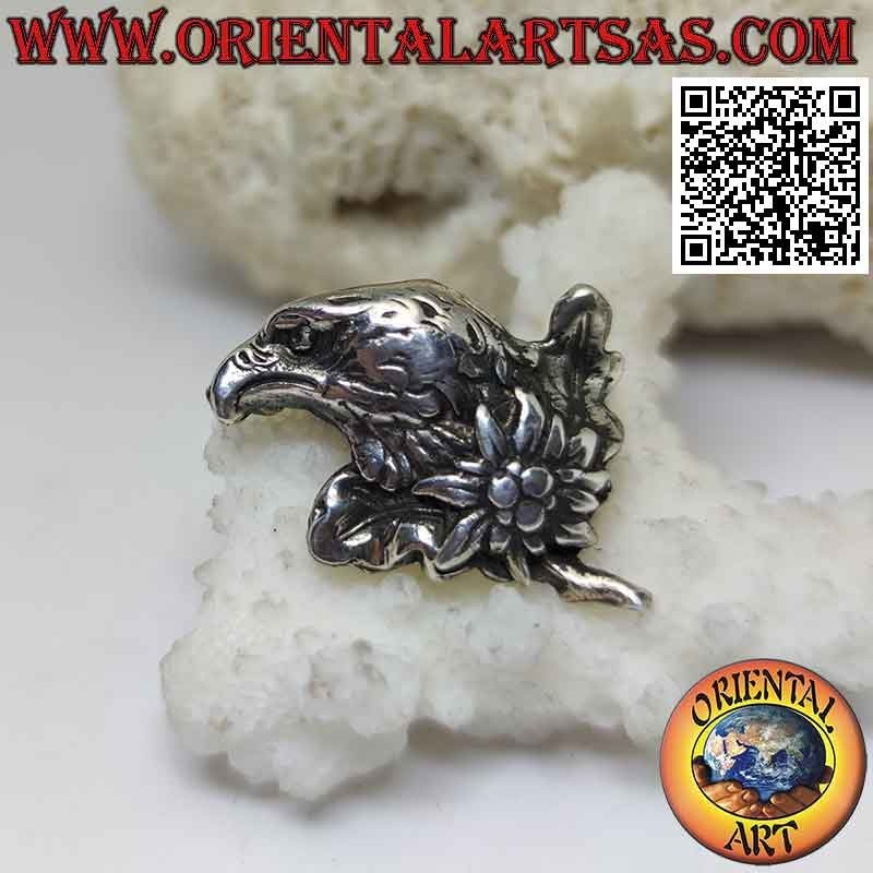 Silver brooch, eagle face in profile with flower on the neck