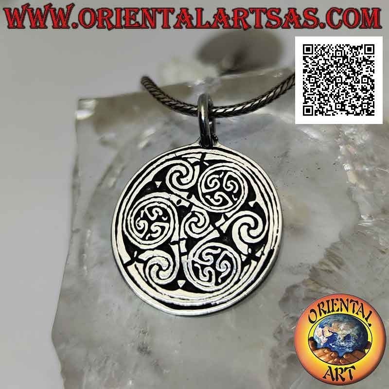 Silver pendant, Celtic medallion with a series of triskell knots / triskelions in bas-relief