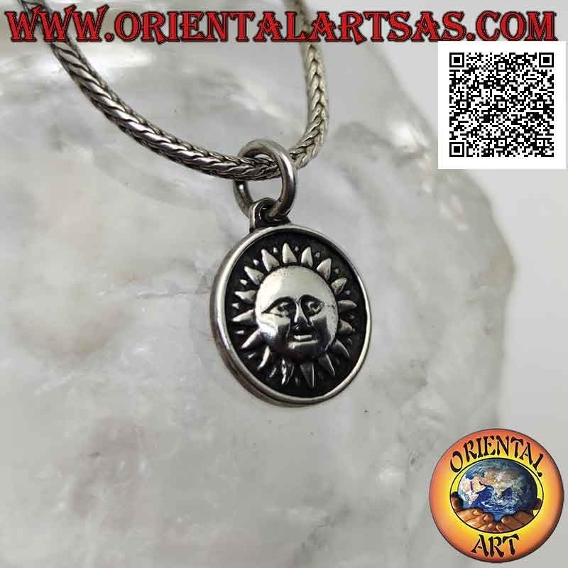Silver pendant, round double-sided medal with sun on one side and moon and stars on the other