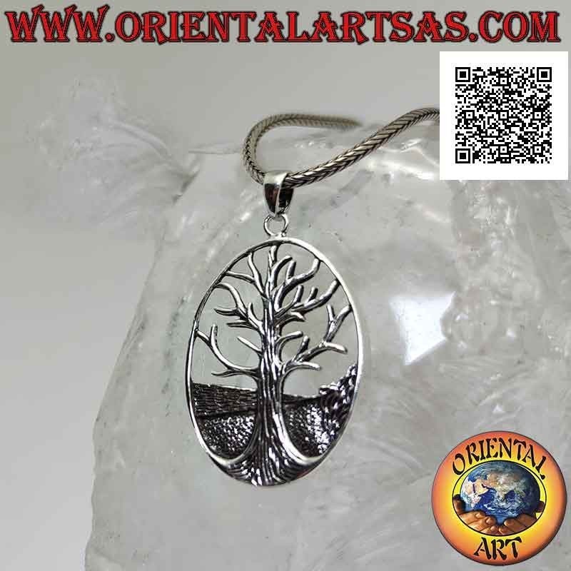 Silver pendant, Yggdrasil or tree of life in the oval with ground in the background