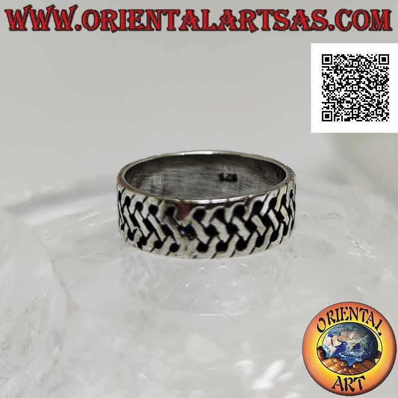 Silver ring with a worked band with a bas-relief woven mesh decoration