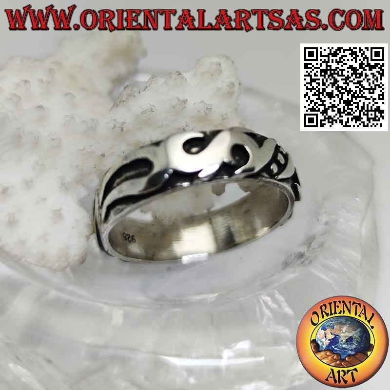Silver ring with worked band with Maori decoration in high relief