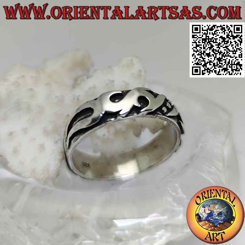 Silver ring with worked band with Maori decoration in high relief