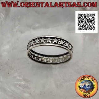 Silver band ring worked with a series of stars in bas-relief