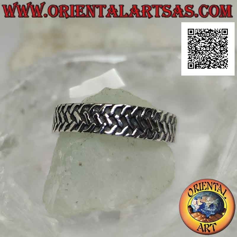 Silver ring with worked band with three rows of intertwined oblique segments