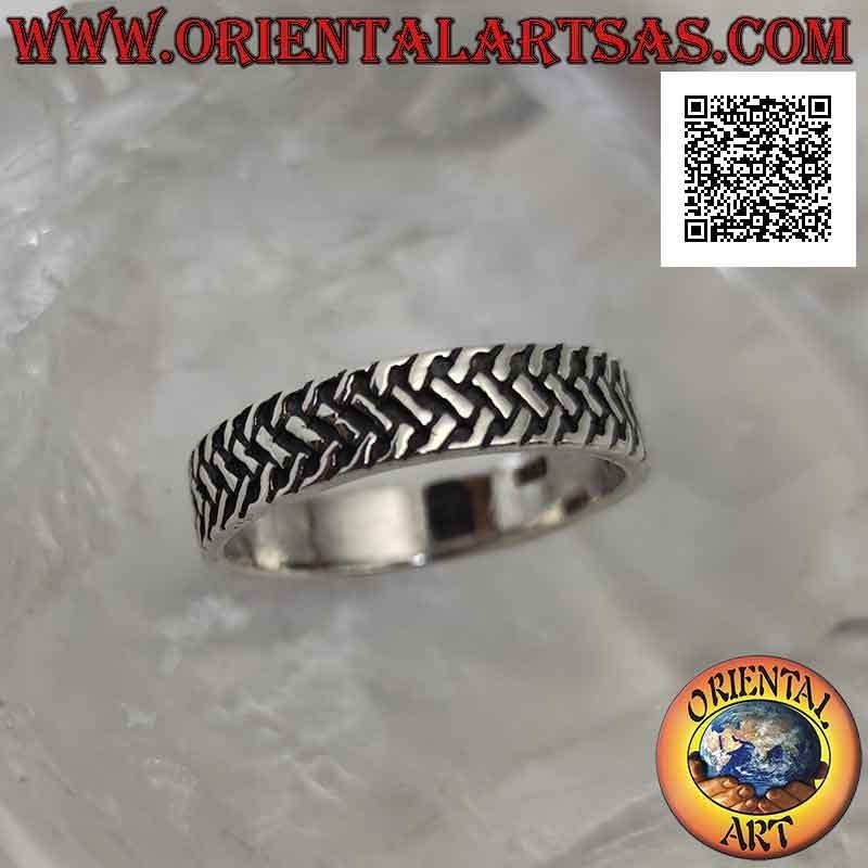 Silver ring with worked band with three rows of intertwined oblique segments