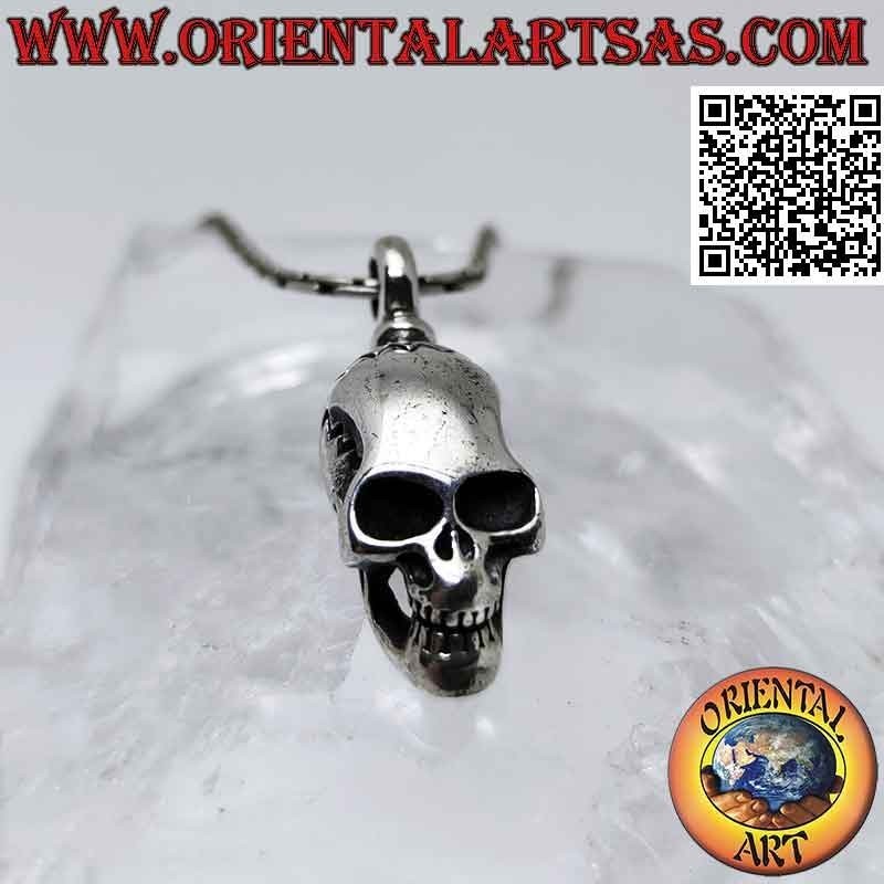 Silver pendant in the shape of a Skull (homo sapiens) with an elongated skull