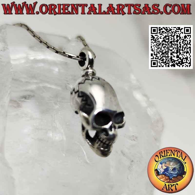 Silver pendant in the shape of a Skull (homo sapiens) with an elongated skull