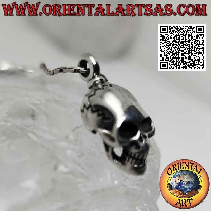 Silver pendant in the shape of a Skull (homo sapiens) with an elongated skull
