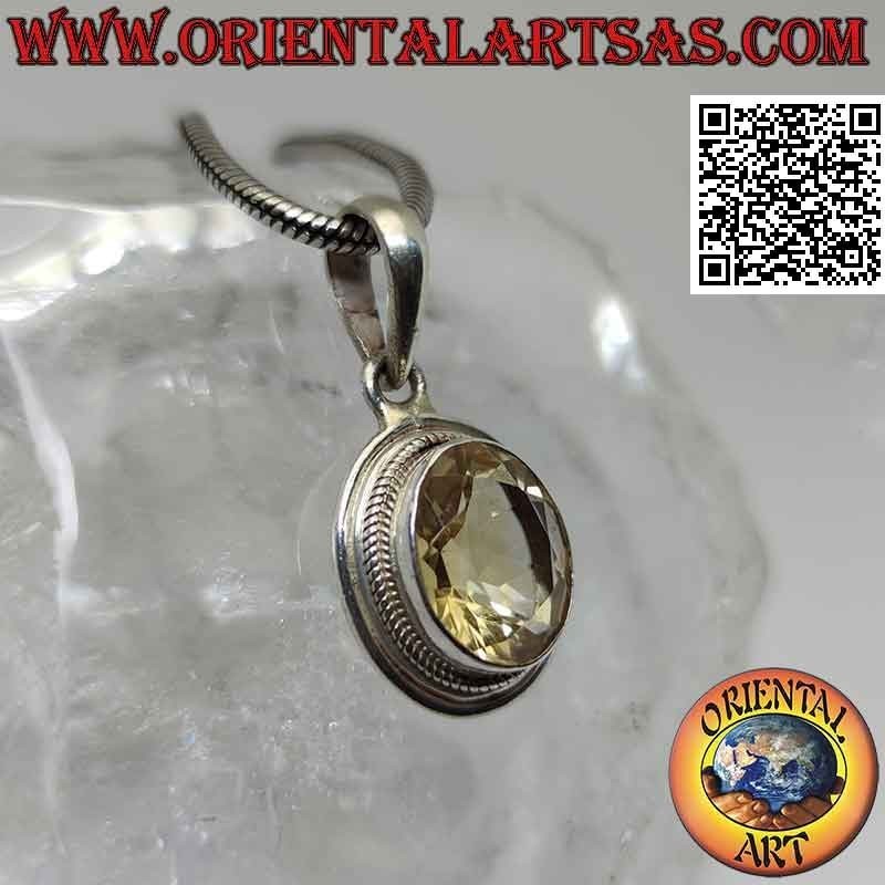 Silver pendant with oval yellow topaz surrounded by interlacing and smooth edge
