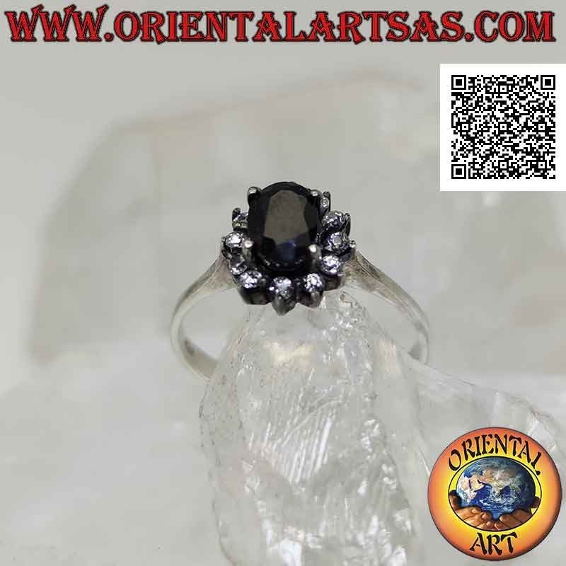 Anillo flor de plata con zafiro ovalado natural engastado con pétalos de circonitas blancas engastadas