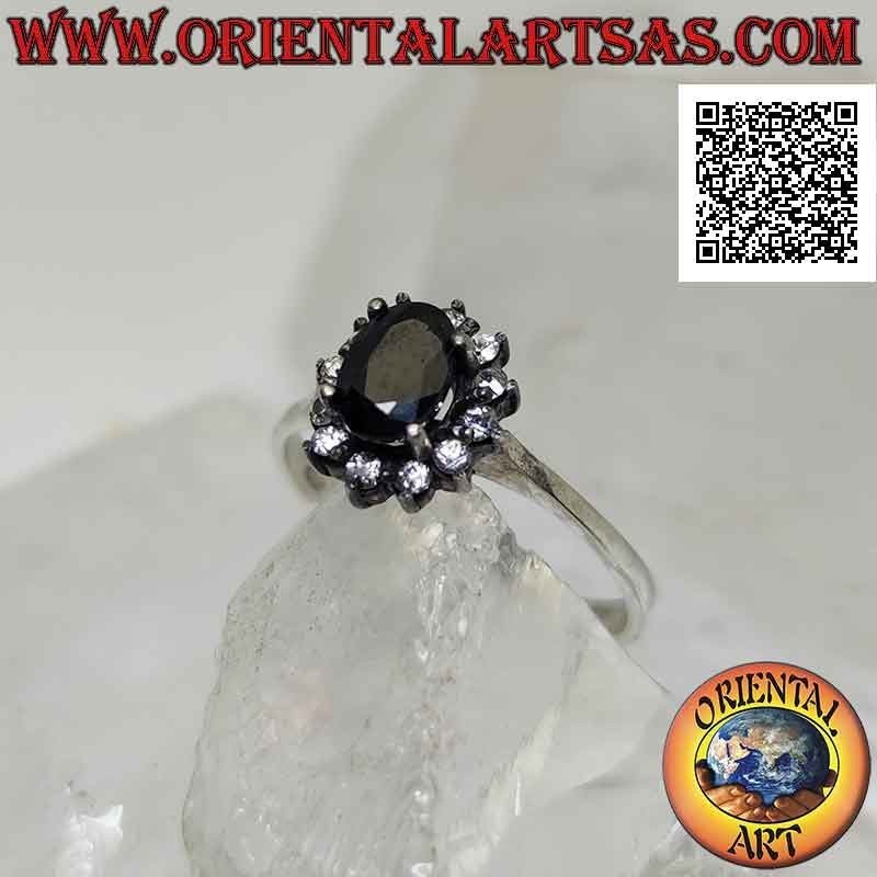 Silver flower ring with natural oval sapphire set with white zircon petals set