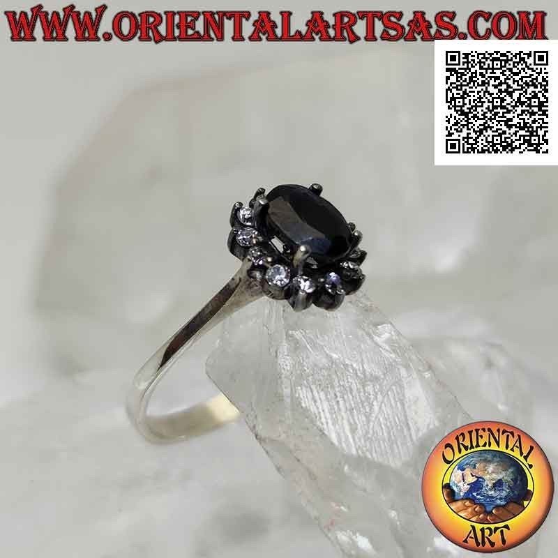 Silver flower ring with natural oval sapphire set with white zircon petals set