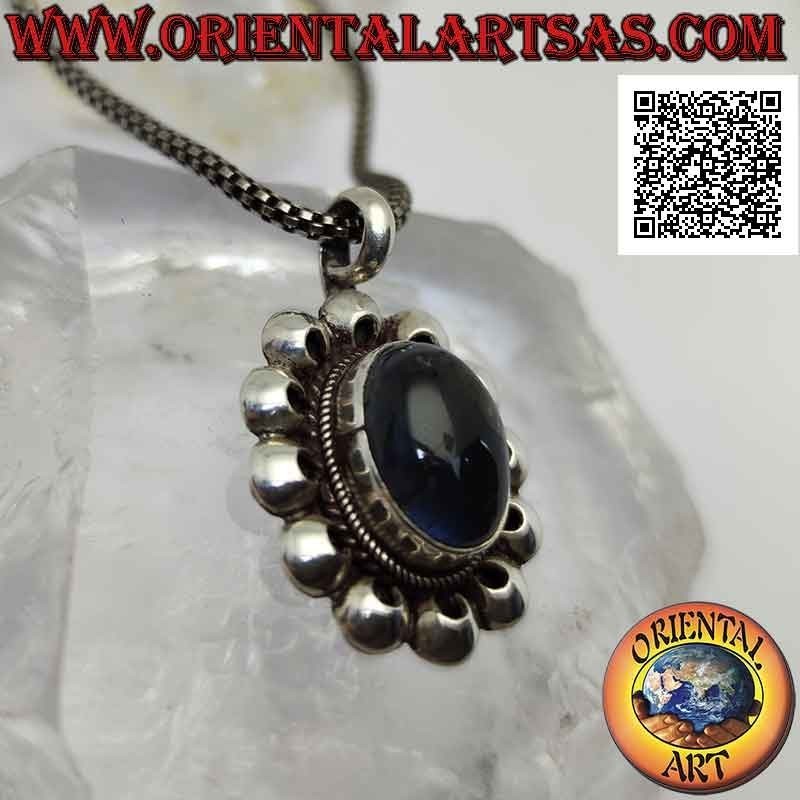 Silver pendant with midnight blue fluorescent labradorite surrounded by perforated discs