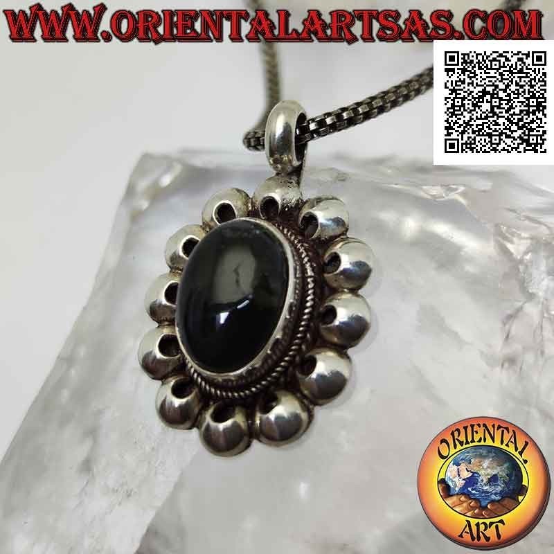 Silver pendant with midnight blue fluorescent labradorite surrounded by perforated discs