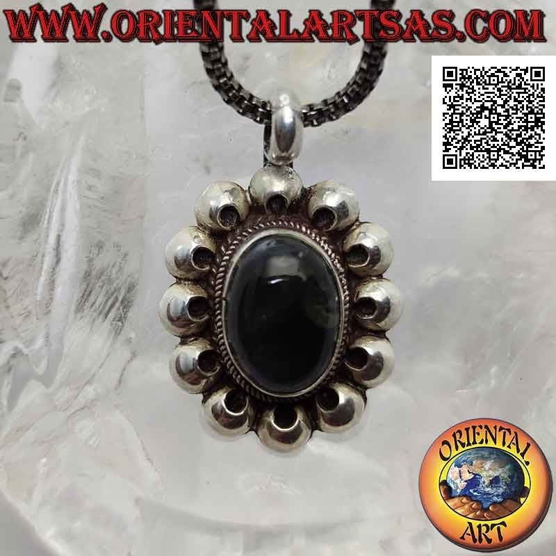 Silver pendant with midnight blue fluorescent labradorite surrounded by perforated discs