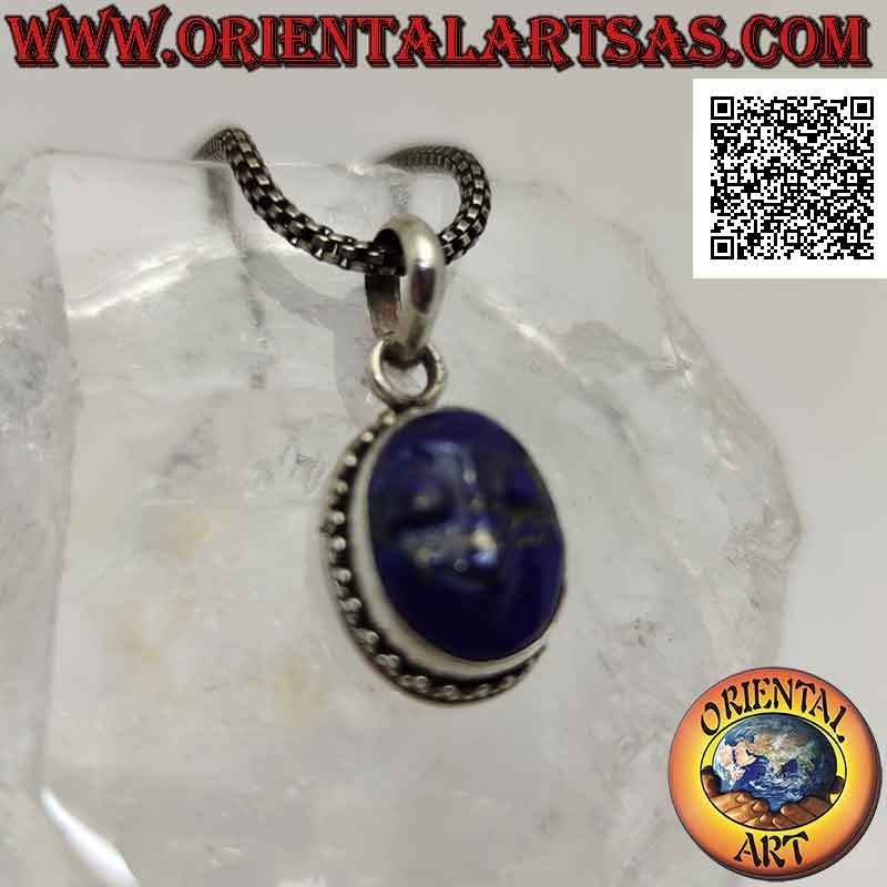 Silver pendant with the face of serenity engraved on lapis lazuli surrounded by trio of balls