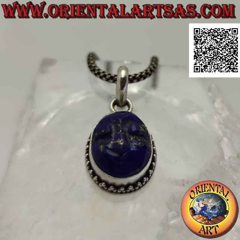 Silver pendant with the face of serenity engraved on lapis lazuli surrounded by trio of balls