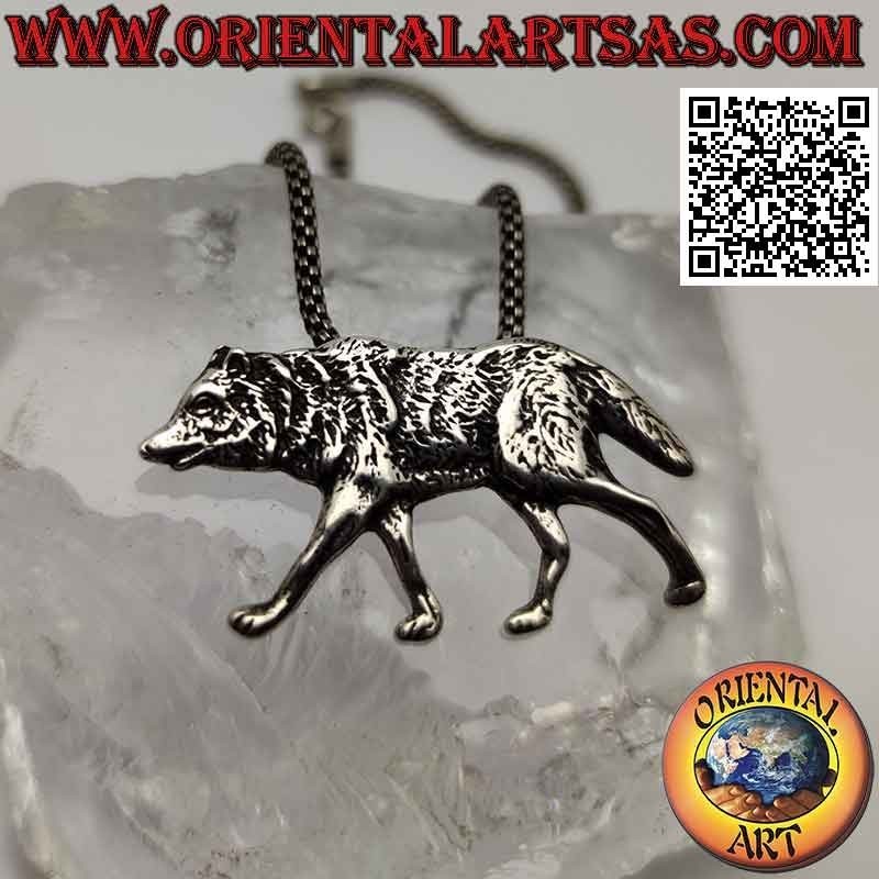 Silver pendant, wolf walking in profile