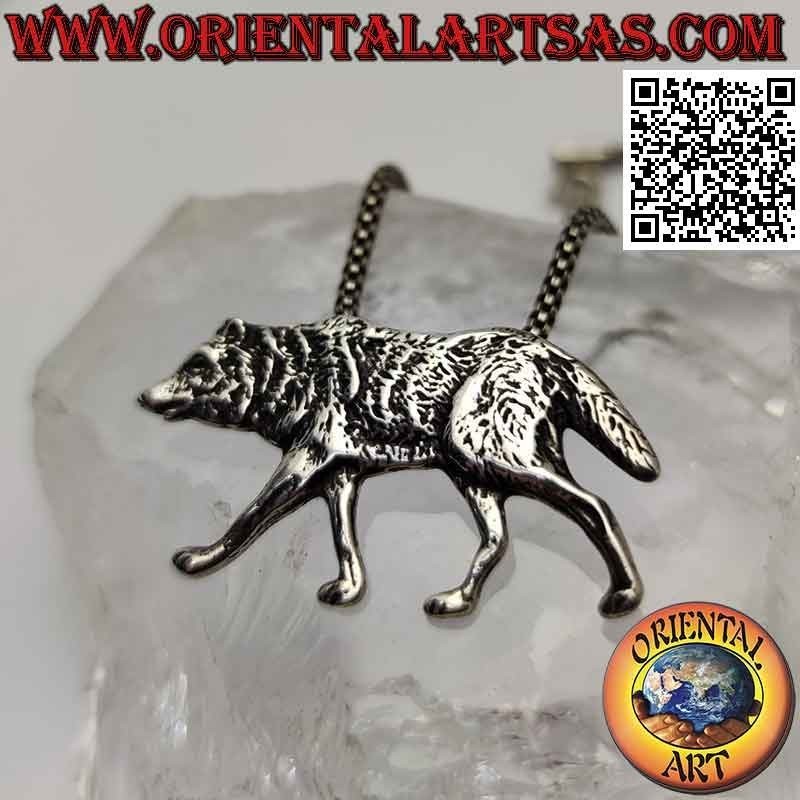 Silver pendant, wolf walking in profile