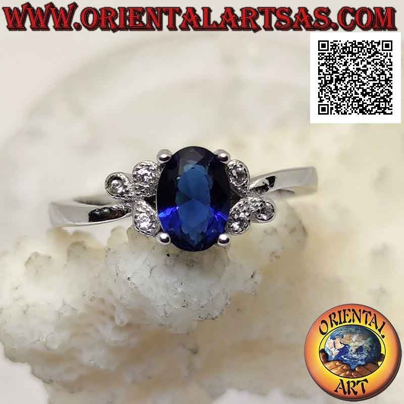 Bague en argent avec saphir synthétique ovale serti et trois zircons blancs sur les côtés