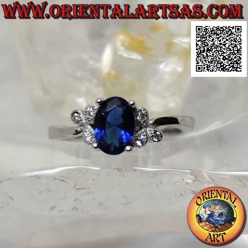 Silver ring with oval synthetic sapphire set and three white zircons on the sides