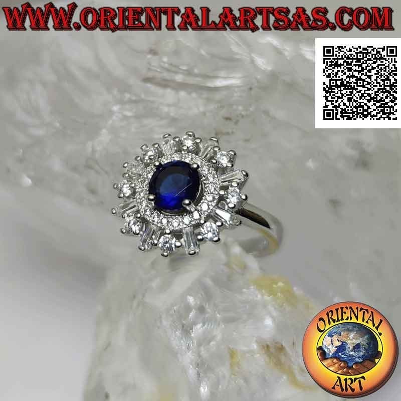 Silver ring with round synthetic sapphire set surrounded by a band and round and baguette zircons